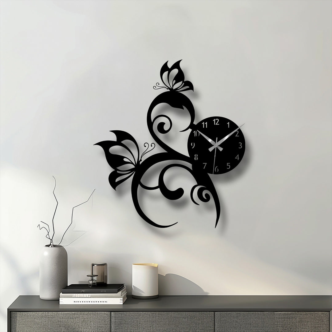 The elegant metal art for wall, a butterfly vine clock, showcases a striking transition from the stark black design to subtle gray shadows on the white background.