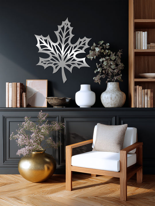 Cool color temperature emphasizes the reflective silver maple leaf metal art for wall, contrasting with the room's warm, neutral tones and wooden accents.