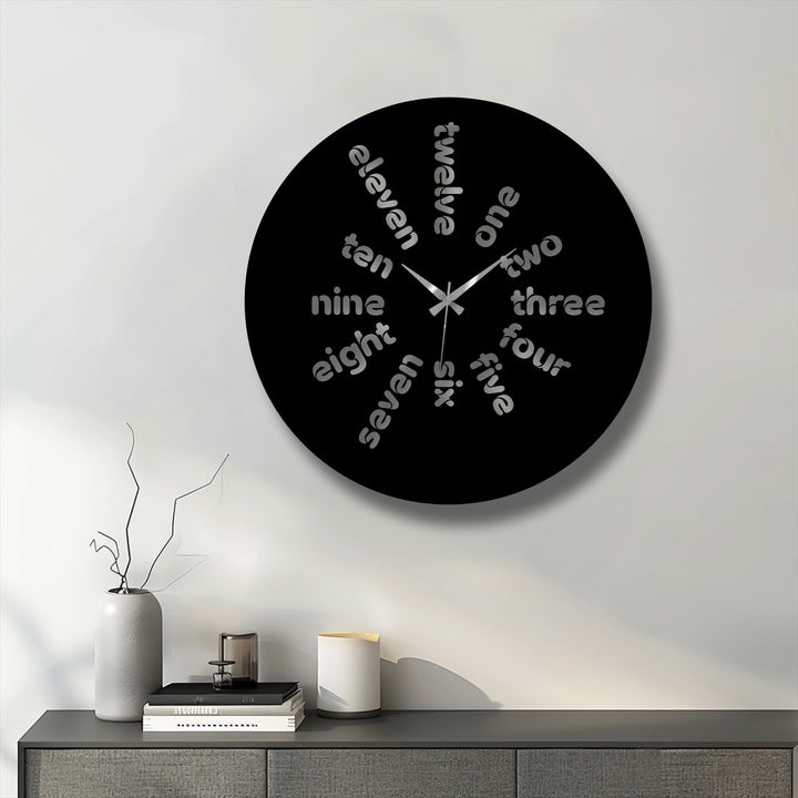 The captivating central subject is a black word time metal art for wall clock, displaying a modern typography design with the hour markers spelled out.