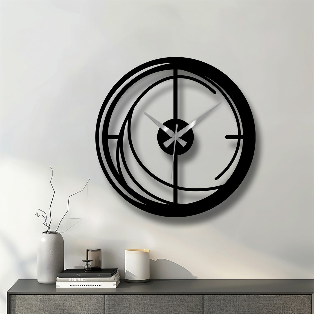 Minimal color saturation emphasizes the bold black lines of this modern spiral metal wall clock, a statement piece of decorative metal art.