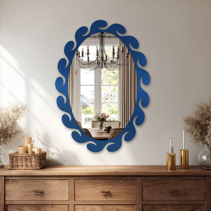 Soft reflections fill the stained glass wall mirror, an oval floor mirror with fluid, gentle wave-like details in its frame.