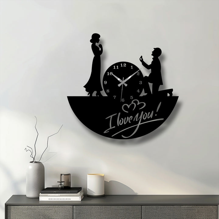 Lit by a soft glow, this image showcases a unique metal wall art clock depicting a romantic love proposal scene.