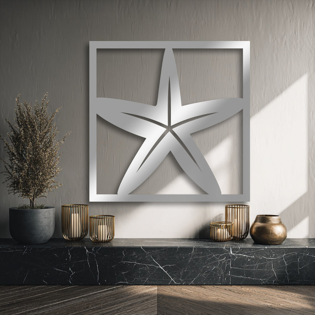 The dark marble counter and wood floor provide a deep foundation, elegantly displaying the framed starfish metal decoration wall art.