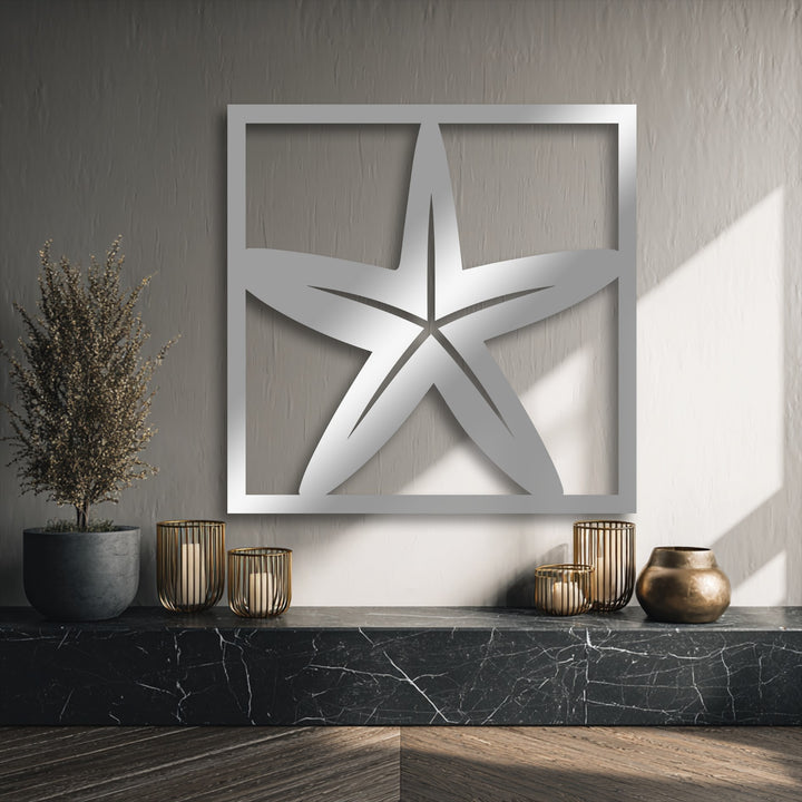 The dark marble counter and wood floor provide a deep foundation, elegantly displaying the framed starfish metal decoration wall art.