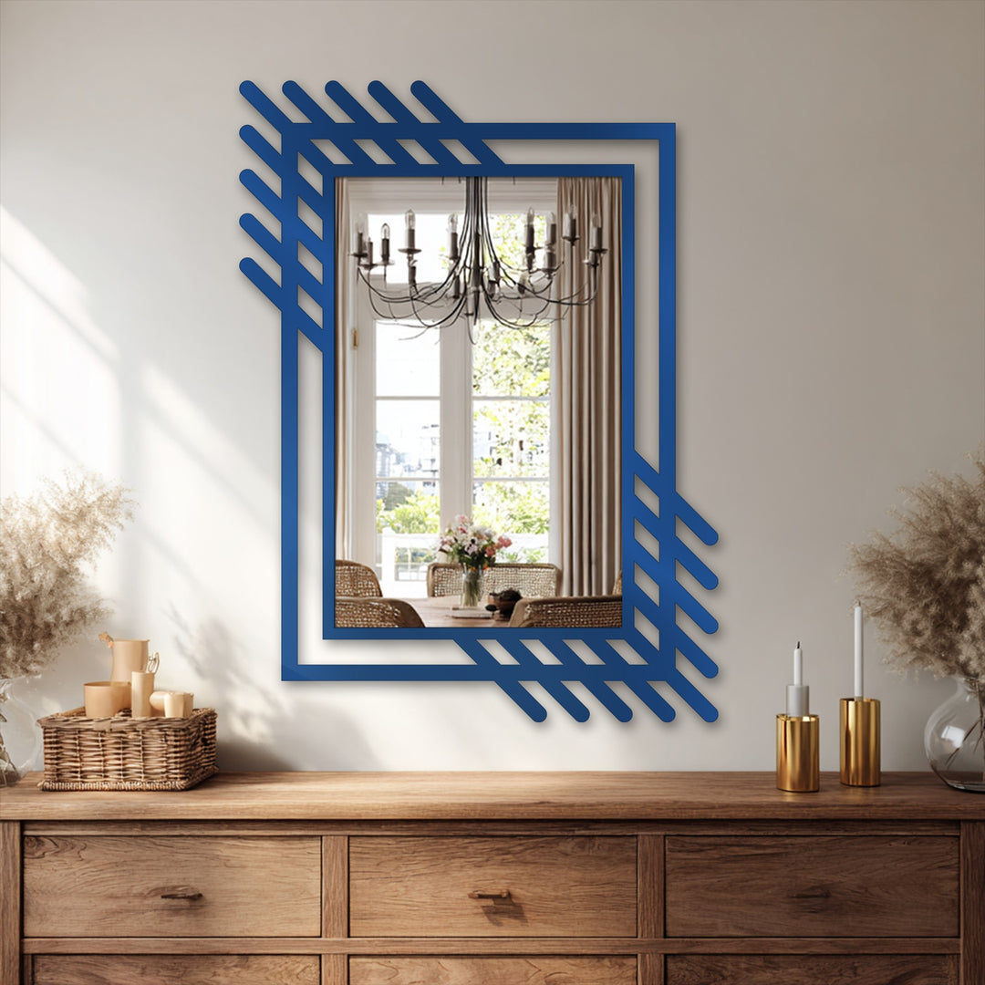 Welcoming and refined, the framed wall mirror reflects an inviting dining space, accented by the blue geometric decorative metal art of the abstract linear frame.