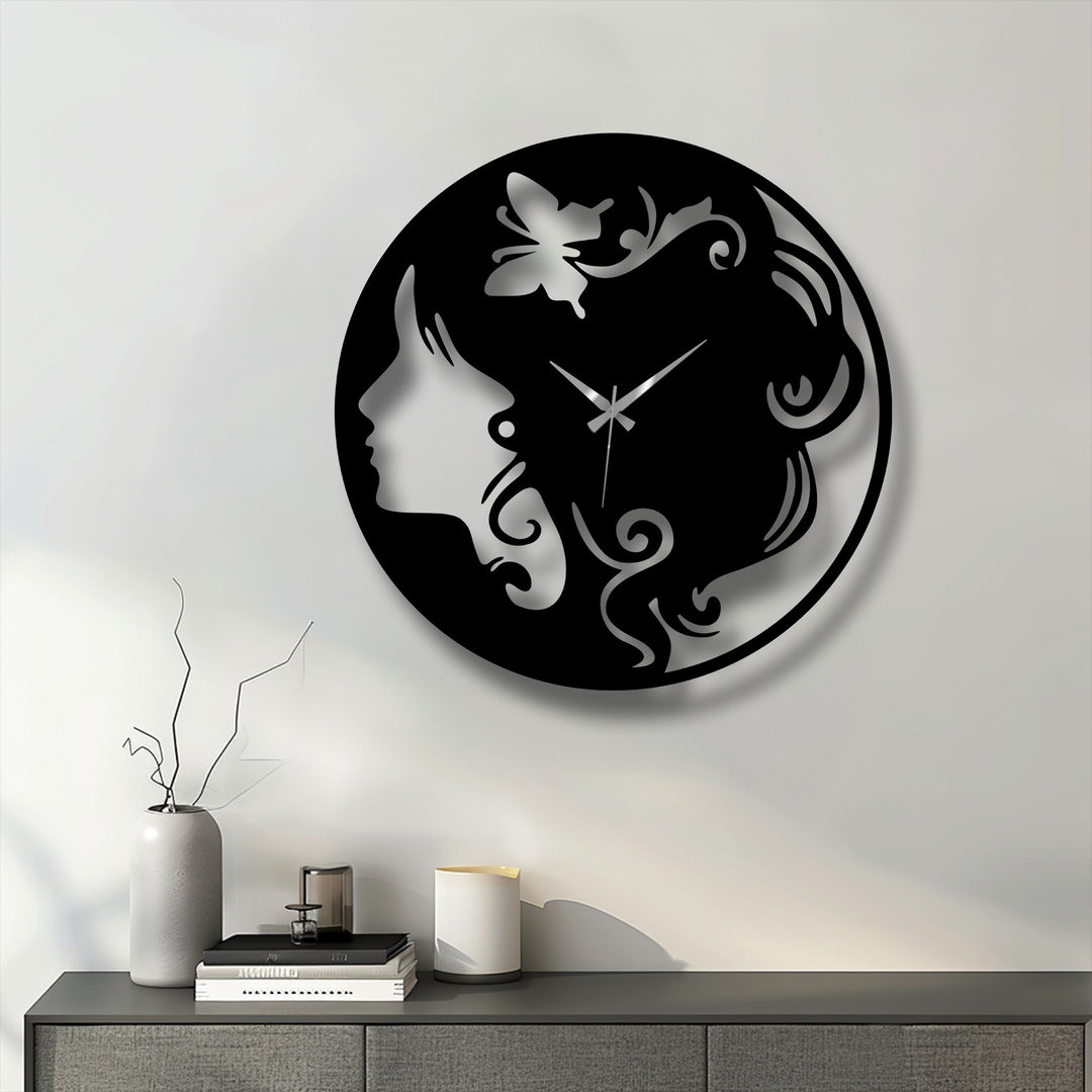 The serene and sophisticated mood of this elegant woman silhouette metal artwork clock with a butterfly design enhances any modern space.