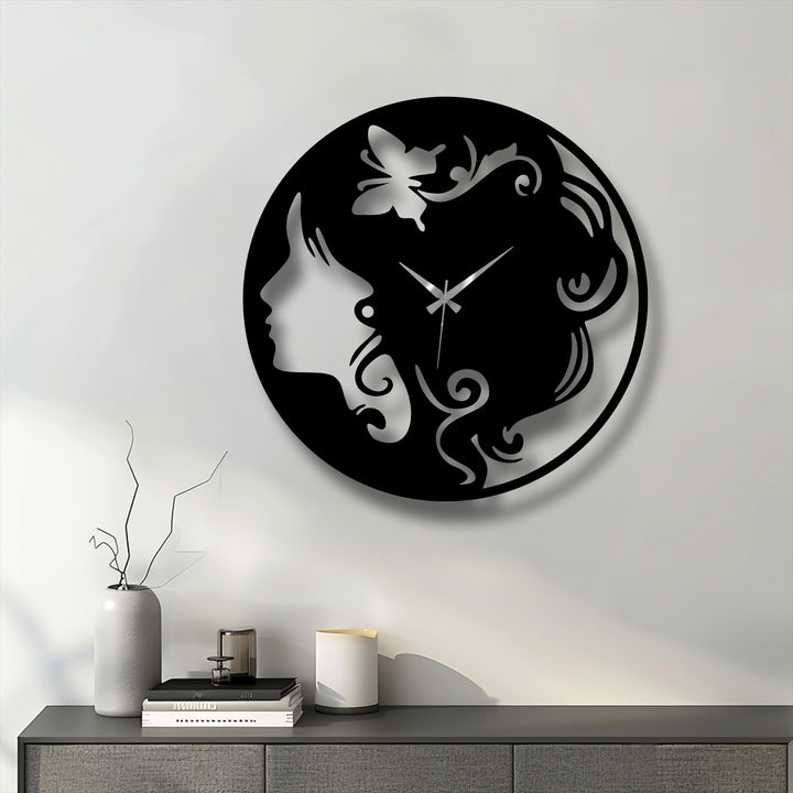 The serene and sophisticated mood of this elegant woman silhouette metal artwork clock with a butterfly design enhances any modern space.