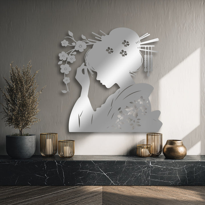 The darkest area, a sleek black marble shelf and rich wood floor, elegantly anchors the oriental Geisha silhouette decorative metal art.
