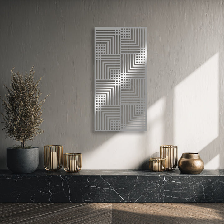 Visual rhythm is evident in the modern geometric metal artwork, featuring repeating linear patterns and grids on a textured wall.