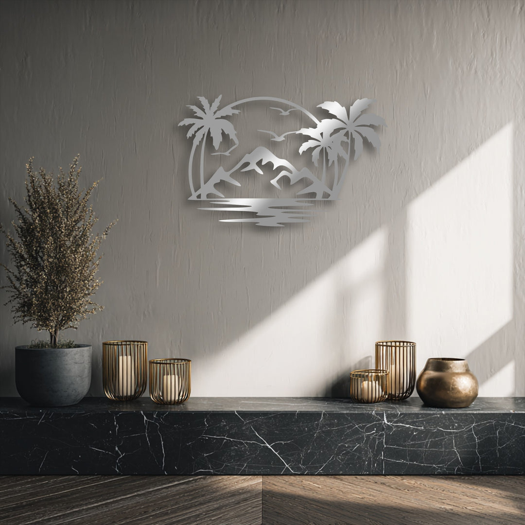 The low color saturation highlights the tropical sunset silhouette metal artwork, a metallic island paradise with palm trees and mountains.