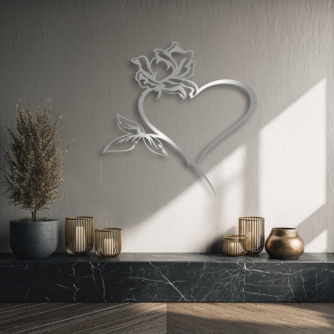 Graceful metal wall decor featuring a rose heart design with a flowing, intertwined shape that suggests blooming movement.