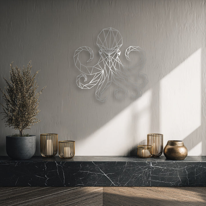 The layering effect highlights the unique metal wall art geometric octopus design, casting soft shadows above a dark marble shelf display.