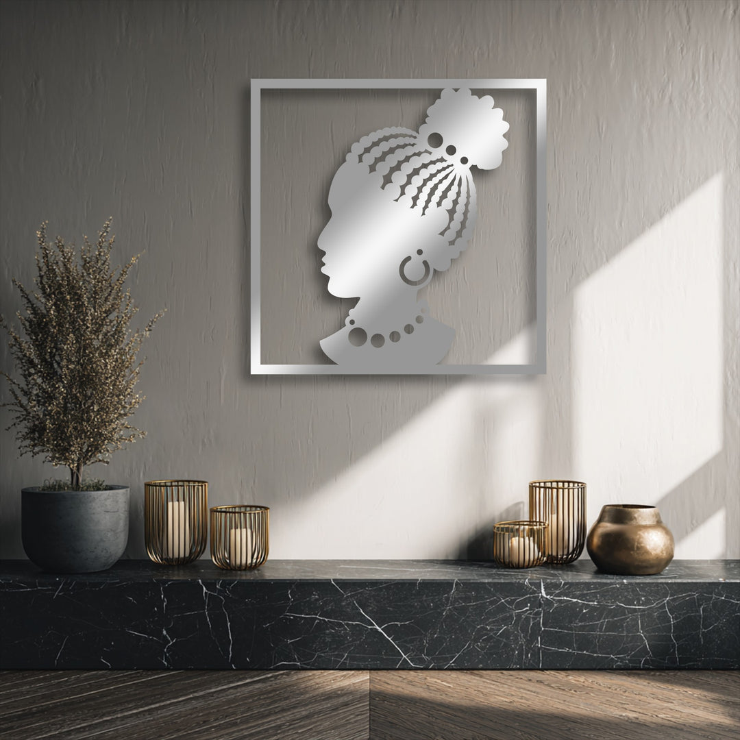 The pronounced color contrast between the radiant silver African woman silhouette metal decoration wall art and the warm, textured wall under sunlight.