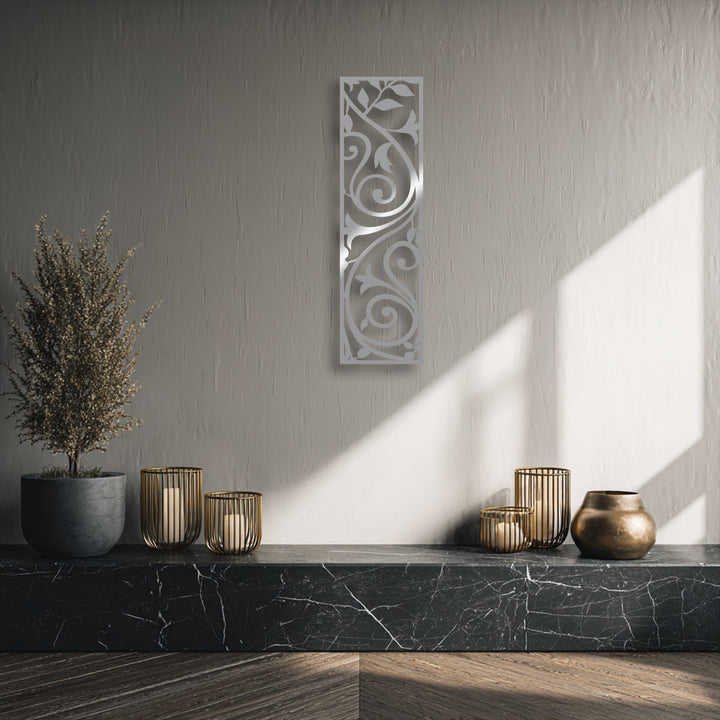 The delicate, feathery texture of a dried plant subtly complements the elegant scroll vine panel metal decoration wall art.
