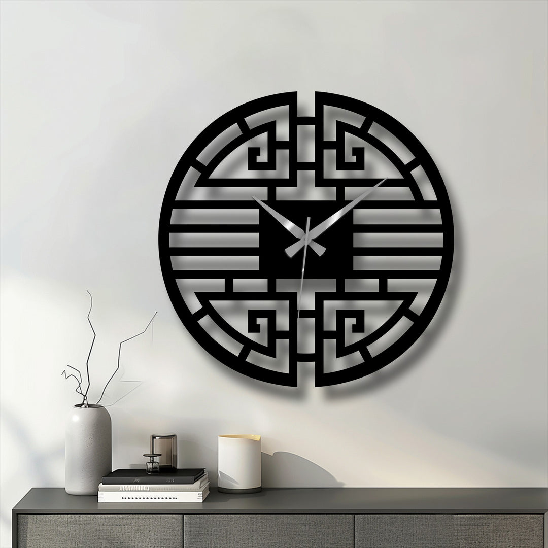 Featuring strong geometric elements, this Asian-inspired metal wall clock showcases a striking pattern, creating a unique piece of decorative metal art.