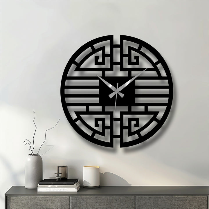 Featuring strong geometric elements, this Asian-inspired metal wall clock showcases a striking pattern, creating a unique piece of decorative metal art.