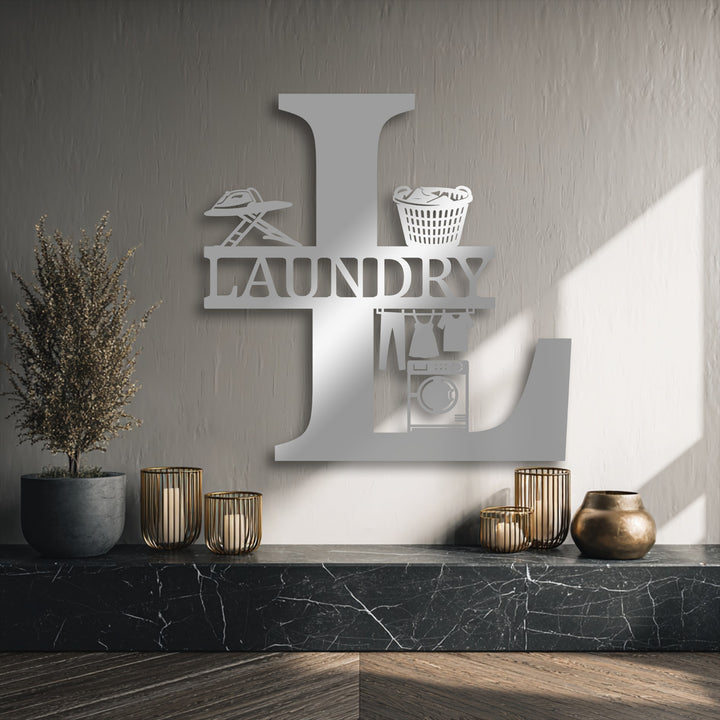 Negative space within the custom initial of this personalized laundry room monogram creates detailed decorative metal art designs.
