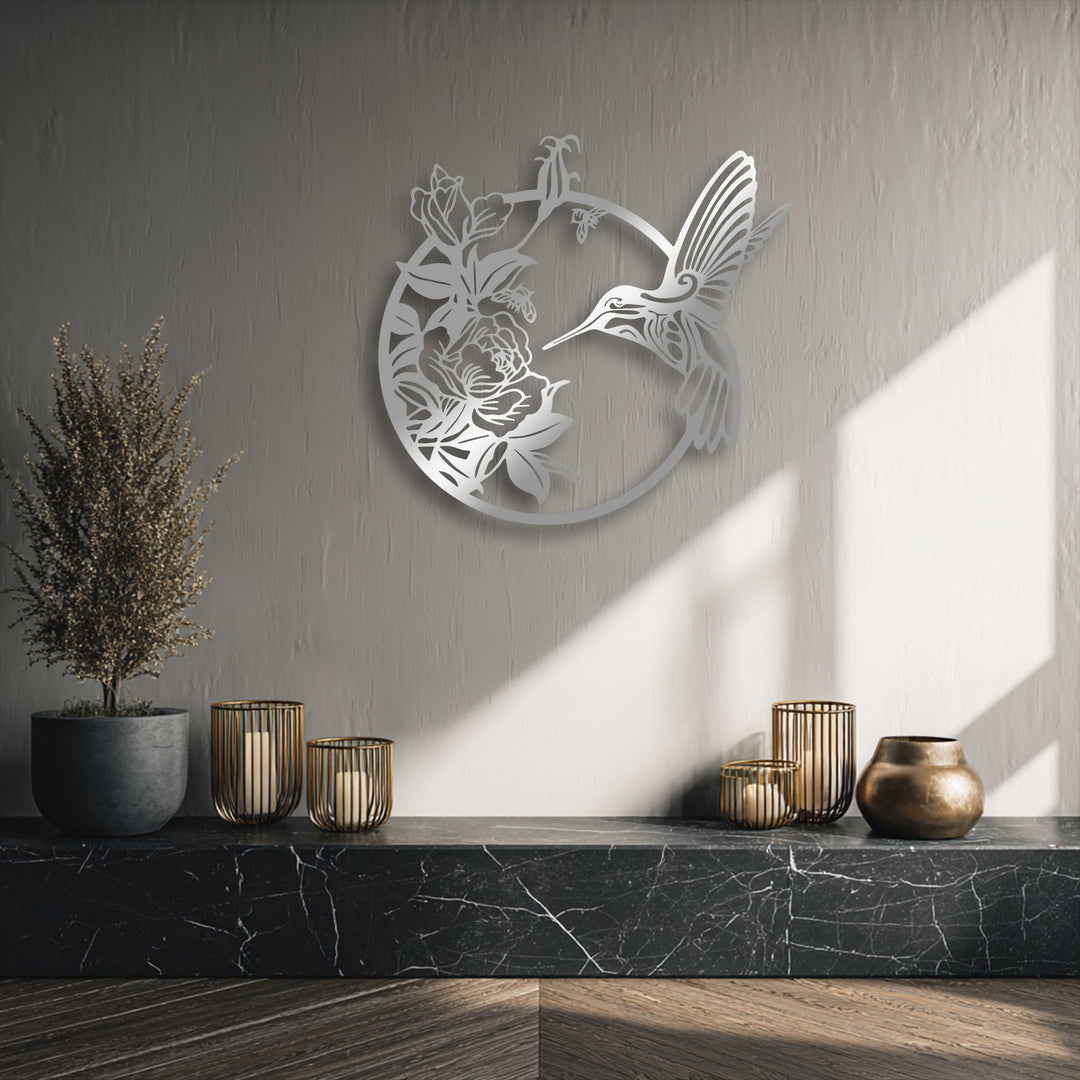 Organic forms of a graceful hummingbird and delicate blooming flowers shape this elegant metal decoration wall art, enhancing the natural beauty.