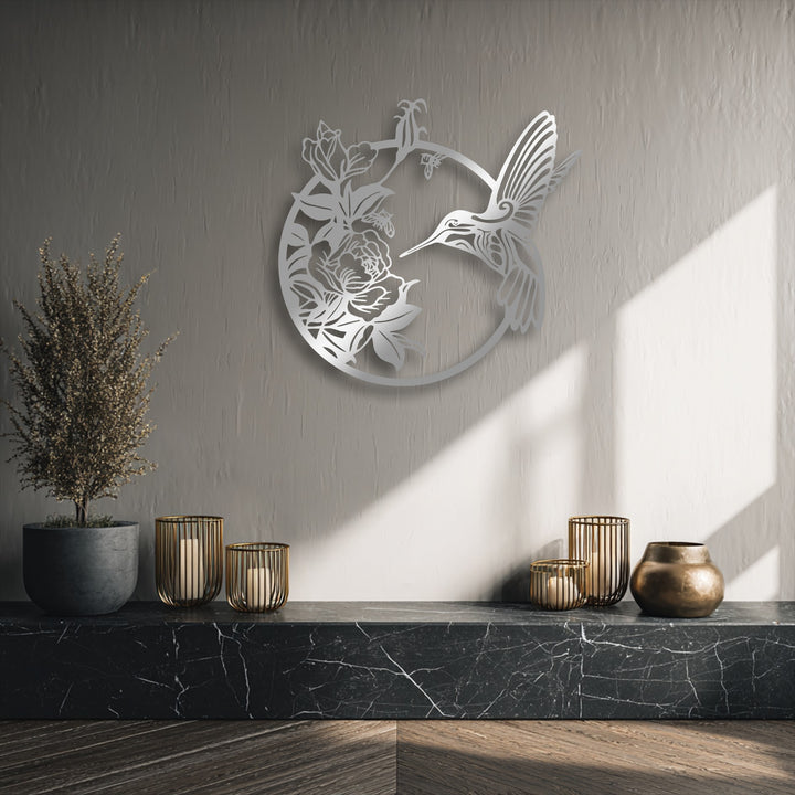 Organic forms of a graceful hummingbird and delicate blooming flowers shape this elegant metal decoration wall art, enhancing the natural beauty.