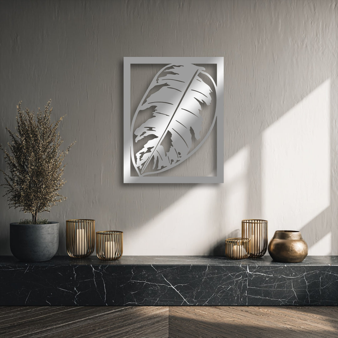 The high material quality of this unique metal wall art showcases a polished silver monstera leaf, enhancing modern botanical decor.