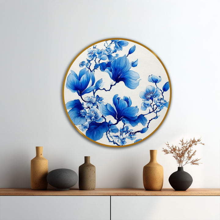 Visible brushstrokes and a tactile surface create a rich texture on this elegant round oil painting art of blue magnolia blossoms.
