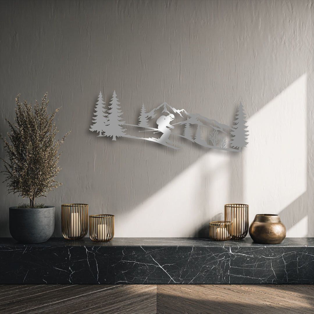 Displaying a compelling layering effect, this unique metal wall art features an alpine skier against a mountain range, creating depth with its shadows.
