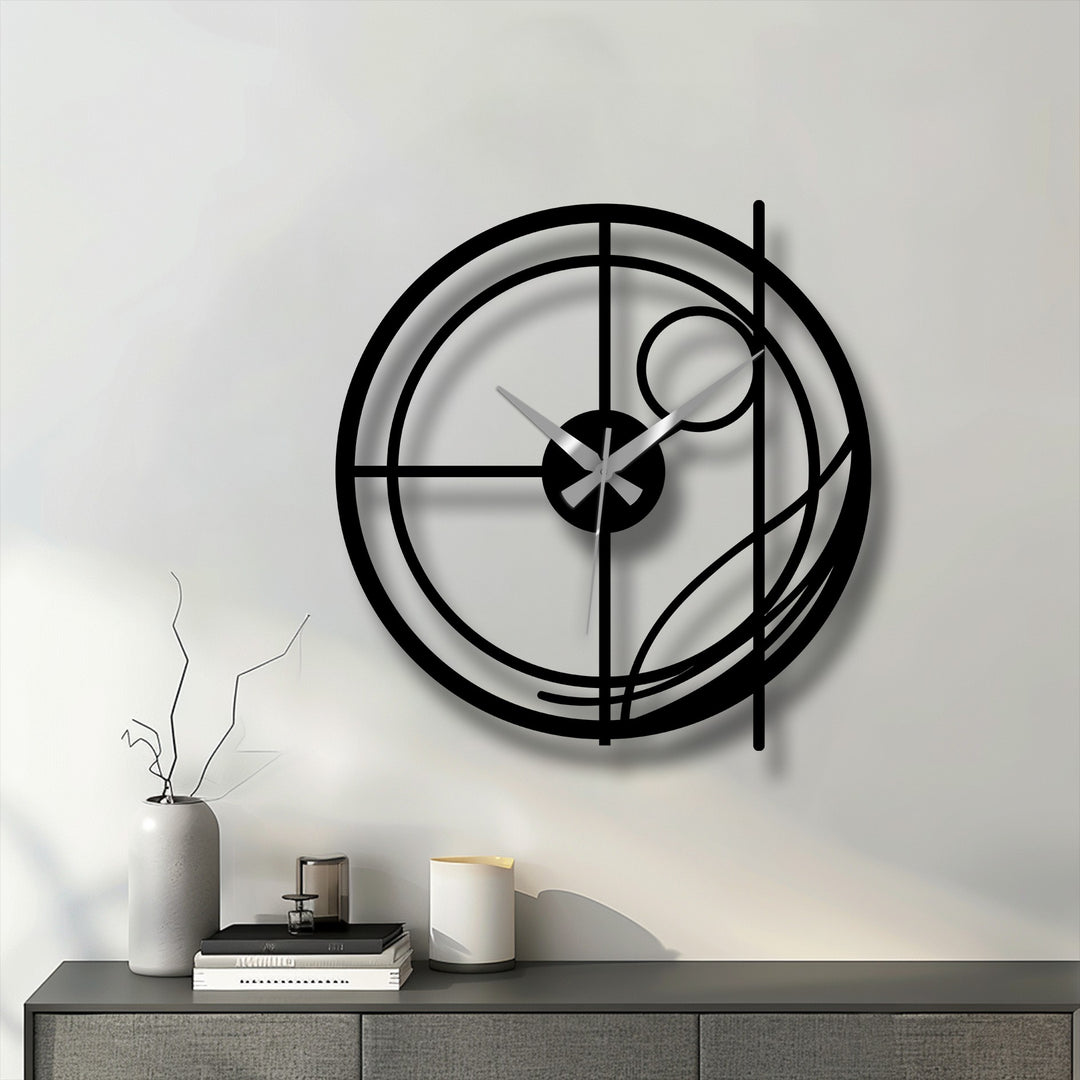 Defined by the transition between colors, this modern abstract metal wall clock shows the interplay of light and shadow across its circular metal artwork design.