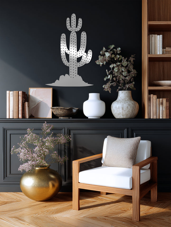 In the foreground, the golden vase and plush chair complement the Saguaro Cactus unique metal wall art on the panelled wall.