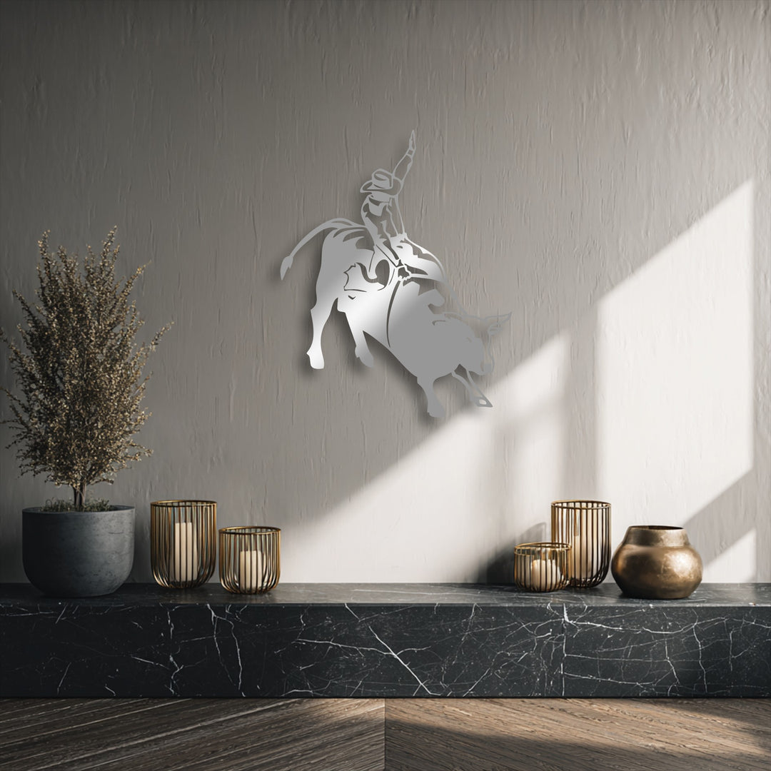 The visual rhythm of the unique metal wall art, depicting a dynamic rodeo cowboy on a bucking bull, energizes the textured wall.