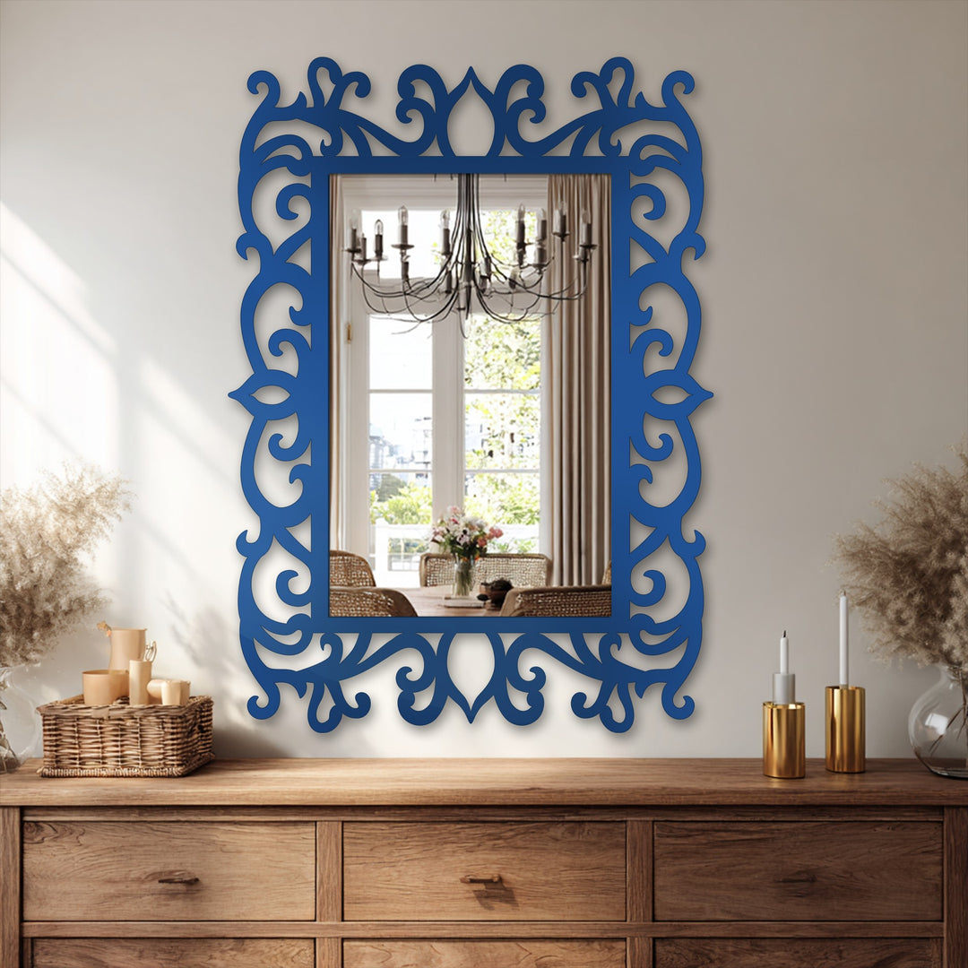 The navy ornate floral scroll frame of the modern wall mirrors surrounds a reflective surface and features elegant details as a central subject.