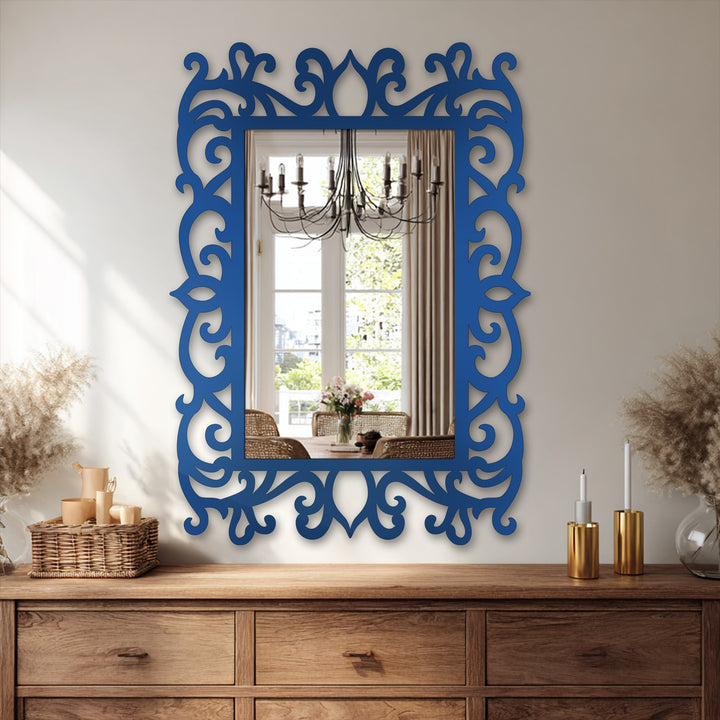 The navy ornate floral scroll frame of the modern wall mirrors surrounds a reflective surface and features elegant details as a central subject.