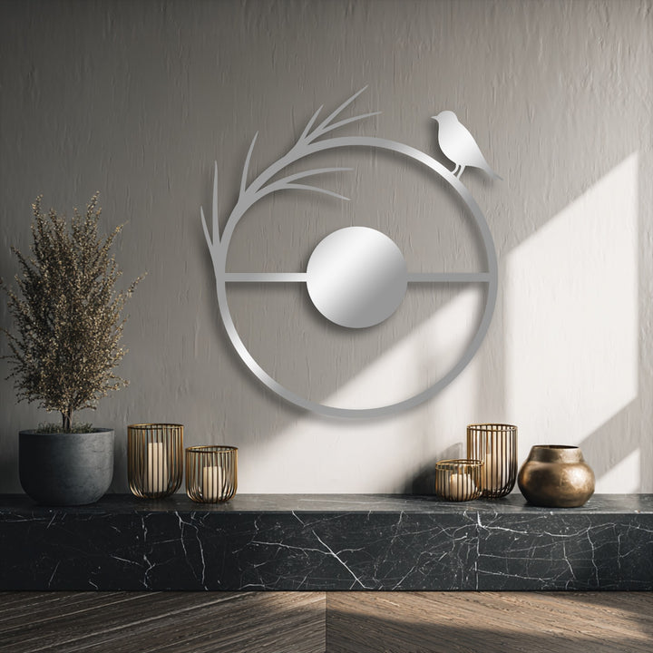 The exceptional material quality of this unique metal wall art piece shines through its sleek, modern minimalist bird and circle design.