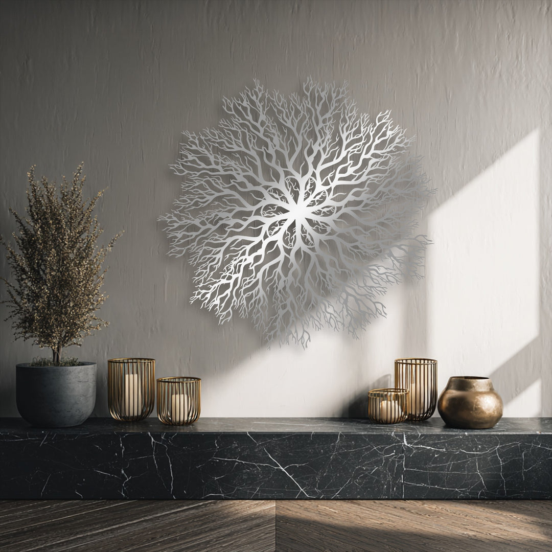 Black marble supports elegant gold candlesticks, a bronze vase, and a dried potted plant in the foreground, complementing the metal art for wall.