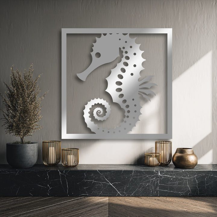 Oriented vertically, the intricate seahorse decorative metal art is presented within a sleek rectangular frame, highlighting its elegant shape.