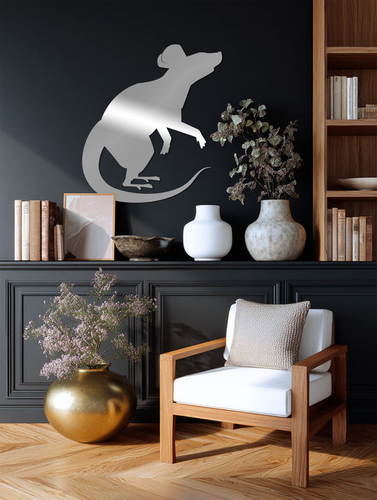 Horizontal modern metal artwork shows a rat silhouette, cut from silver-toned metal in a dynamic pose with its tail curved behind it.