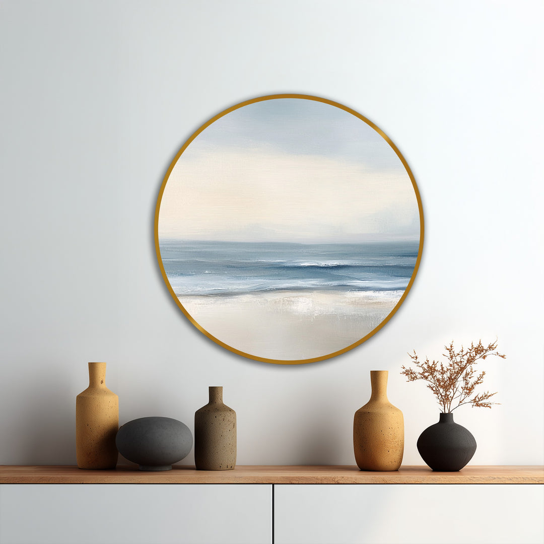 Evoking a peaceful mood, this Soft Tide Serenity depicts a minimalist coastal round oil painting, like an oil painting reproduction print, with calm waves and serene sandy shore.