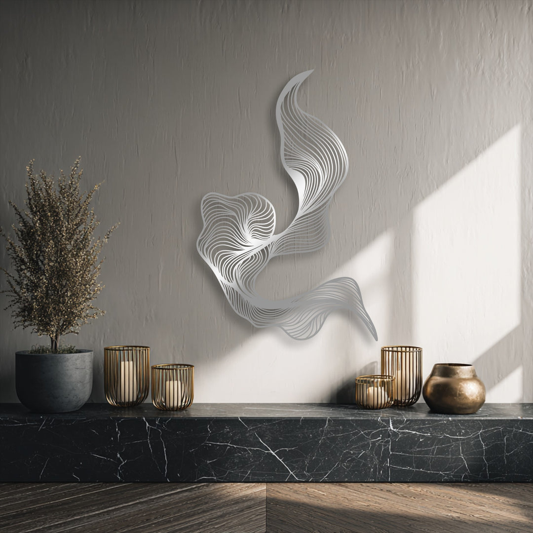 The warm glow of the light subtly highlights the intricate silver metal wall decor and other modern fluid line designs in this inviting scene.
