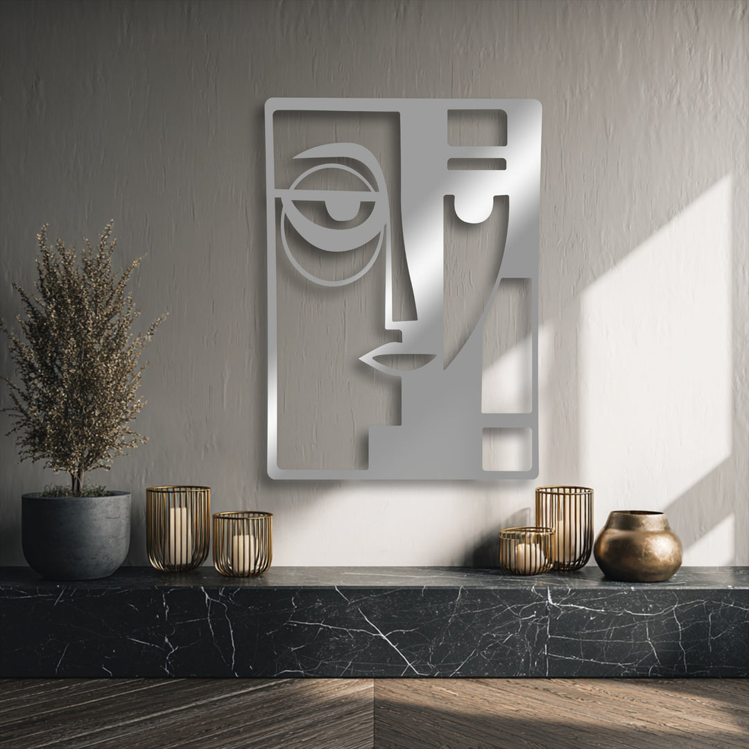 The dominant muted stone grey background highlights a reflective silver Abstract Dual Face unique metal wall art.