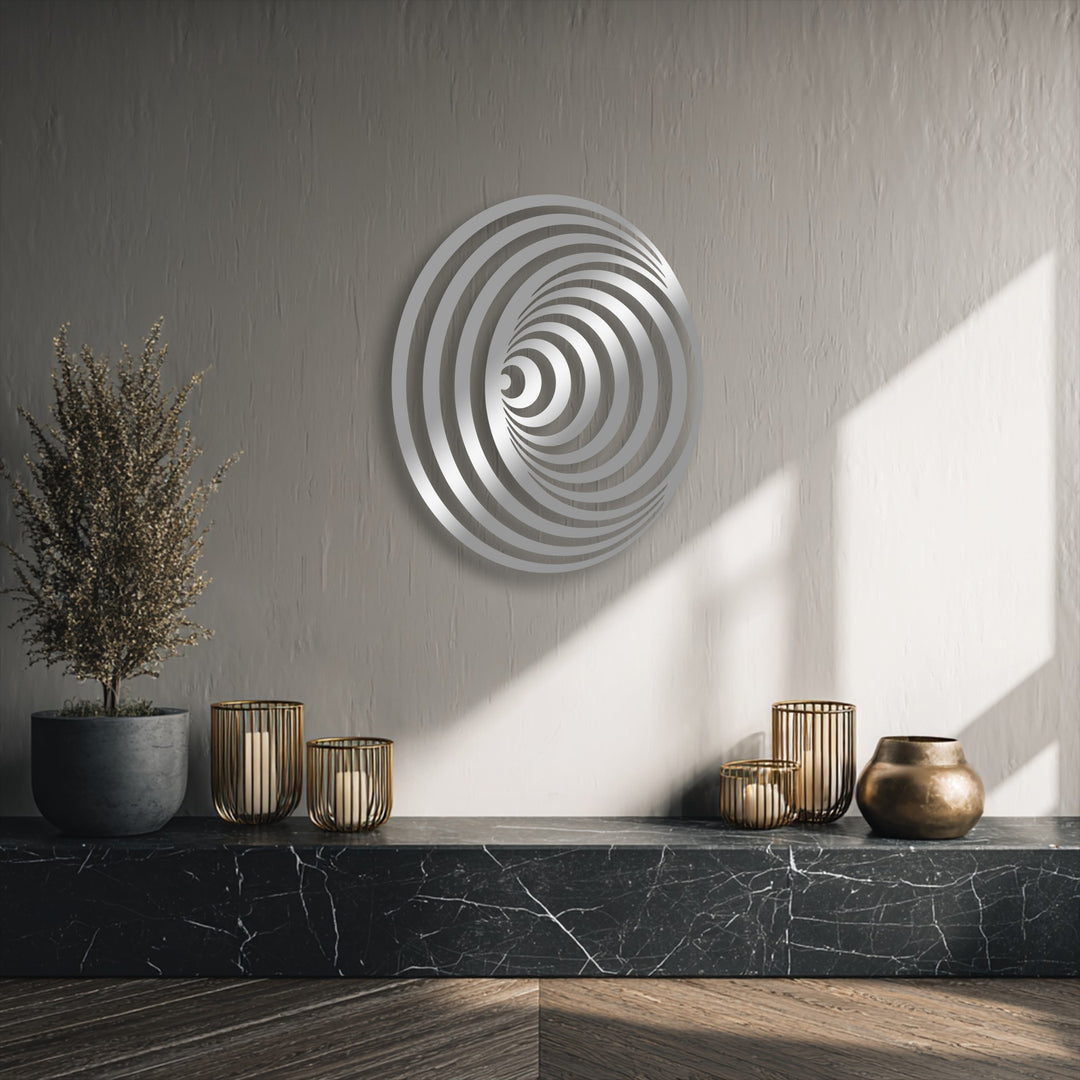 Bright sunlight bathes the textured wall, illuminating the mesmerizing silver hues of the hypnotic spiral circle unique metal wall art.