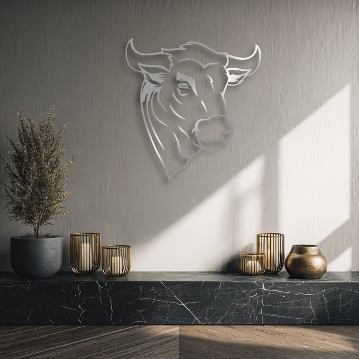 With its understated color saturation, this unique metal wall art showcases a minimal line rustic bull head in a contemporary setting.