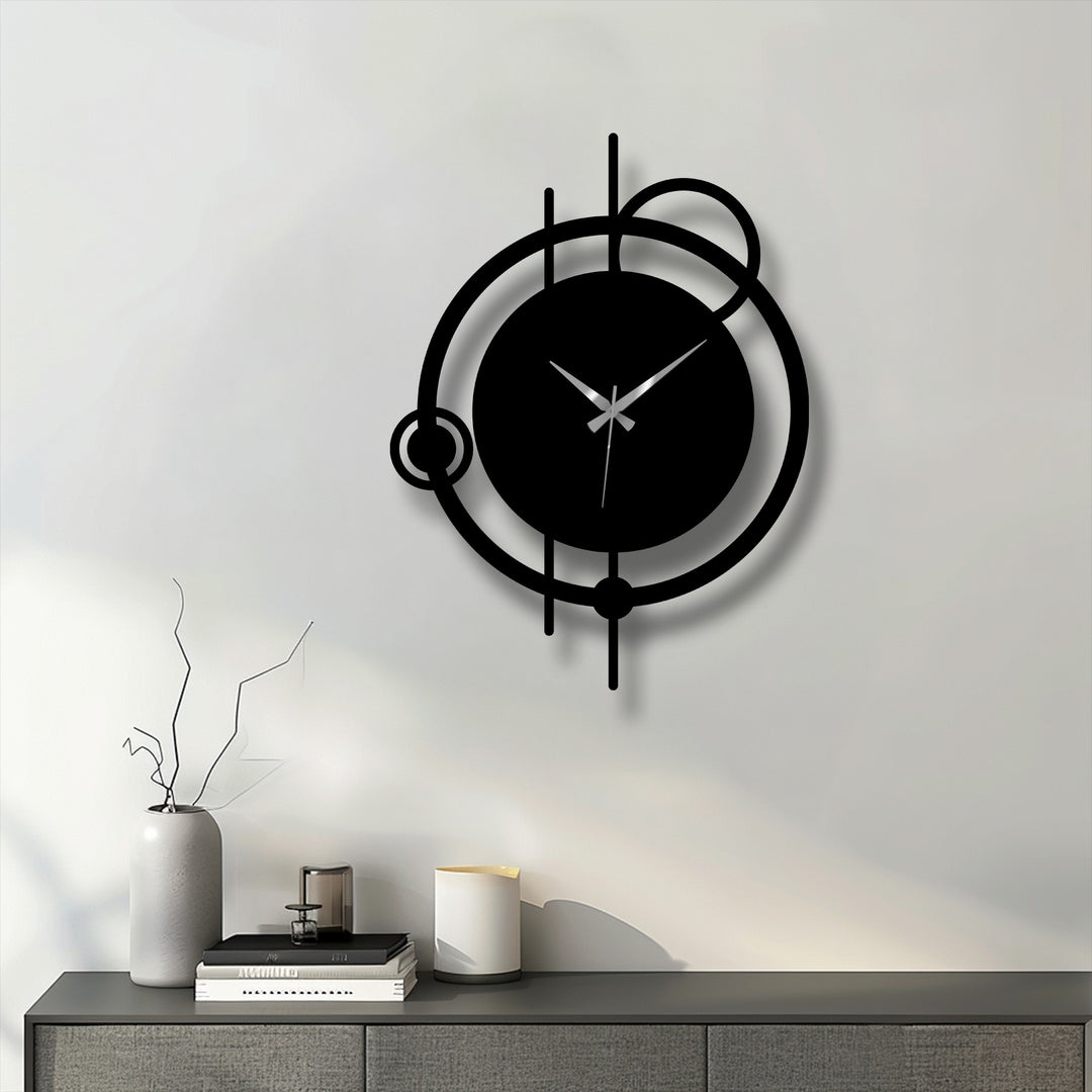 Smooth black finish highlights the abstract orbit metal wall clock’s minimal circle design, creating a striking hanging wall art piece.