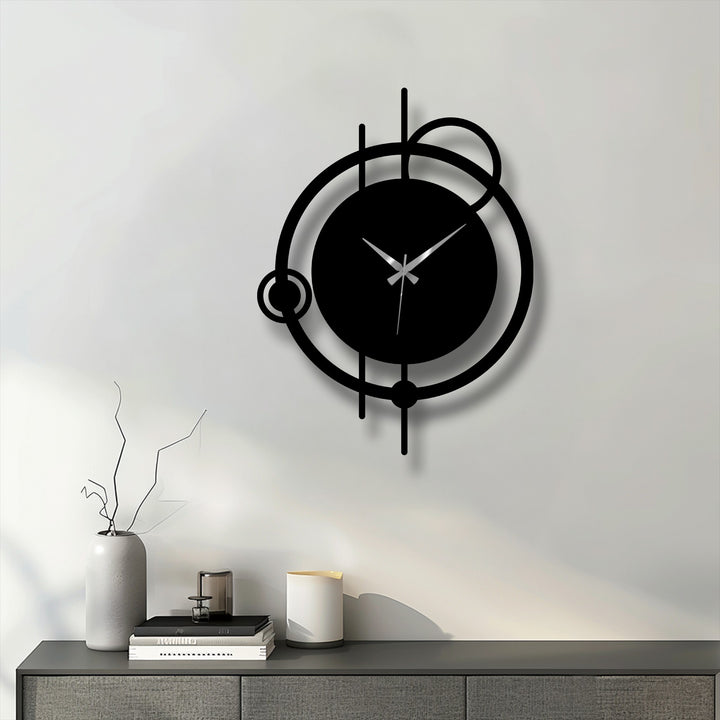 Smooth black finish highlights the abstract orbit metal wall clock’s minimal circle design, creating a striking hanging wall art piece.