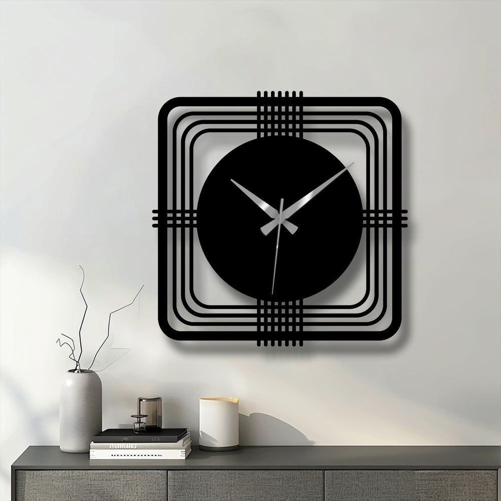 Highlighting the geometric elements, a modern metal wall clock features a square frame and circular face, showcasing decorative metal art with clean lines and a minimalist design.