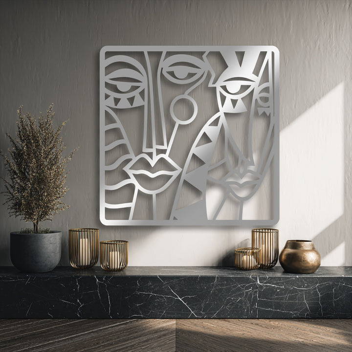 The striking abstract quality of this modern cubist metal artwork features multiple faces in a captivating composition.