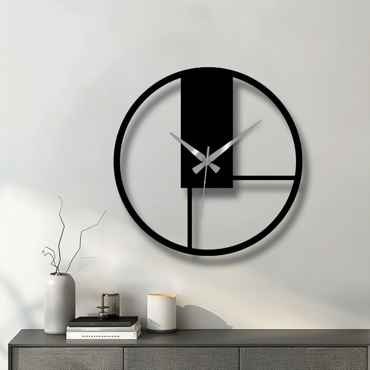 Elegant curves of the minimalist geometric panel metal artwork form a visually striking contrast against the stark lines in this modern wall clock.