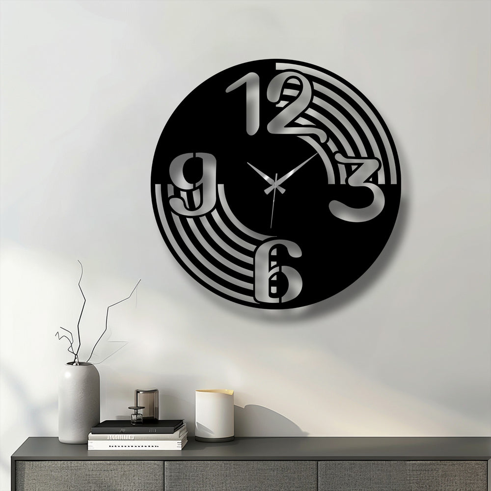 The layered design of this black metal art for wall clock creates depth with its silver numbers and flowing, concentric cut-out lines.