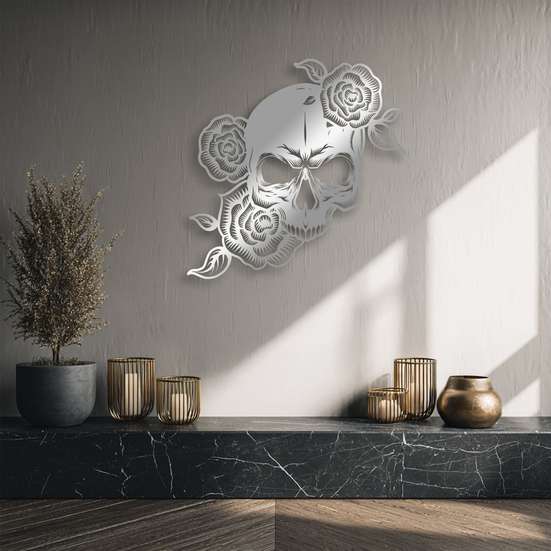 The brightly sunlit wall, illuminated with strong diagonal light, highlights the intricate details of the gothic floral skull metal wall decor.