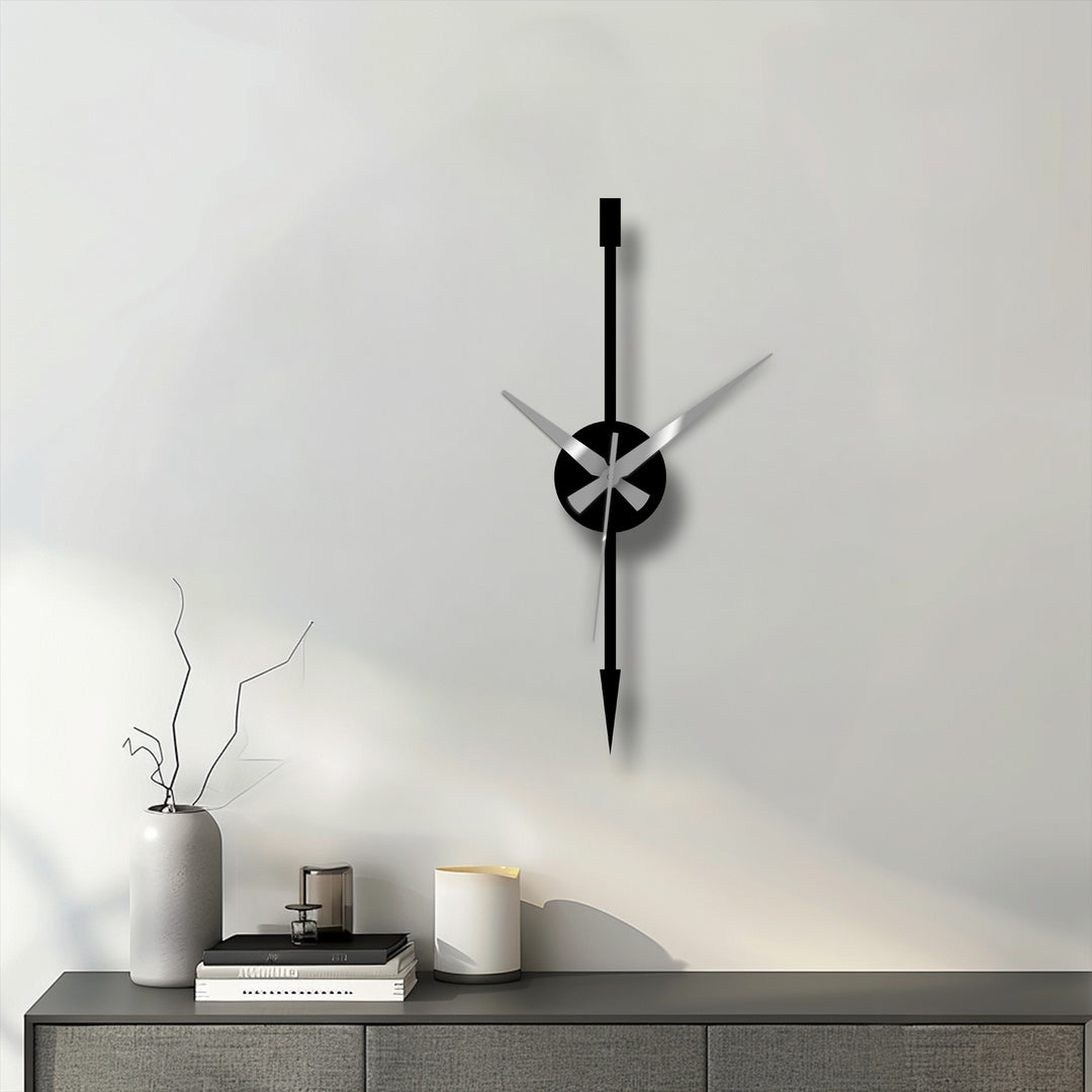 The stillness is captured in this minimalist vertical arrow modern metal art for wall clock design, a sleek statement piece with stationary hands.