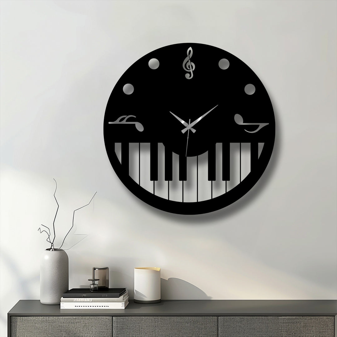 Stillness defines the elegant display of a black music theme piano key decorative metal art clock against a clean white wall.