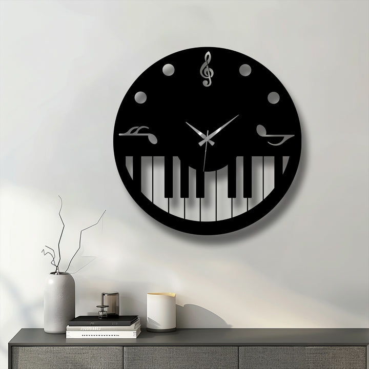 Stillness defines the elegant display of a black music theme piano key decorative metal art clock against a clean white wall.